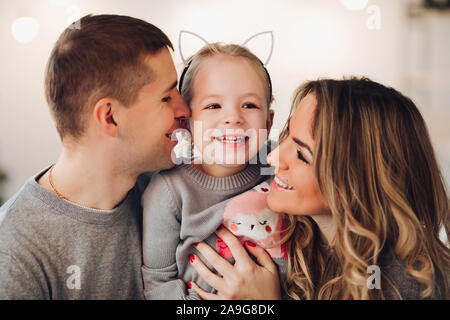 Happy family with a little daughter. Christmas Stock Photo