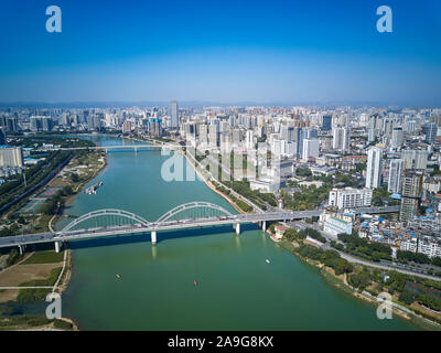 Aerial photos of high-rise residential area along the river and bridge across the river in the city Stock Photo
