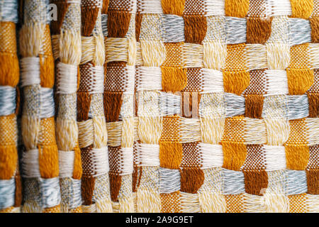 Knitwear Fabric Background of Blanket with a Complex Square Interweaving Stock Photo