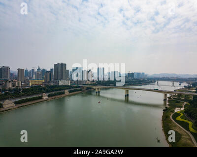 Aerial photos of the river crossing bridge and high-rise buildings along the river in Chinese cities Stock Photo