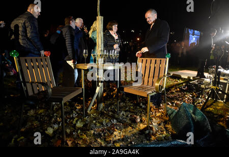 Former Slovak president Andrej Kiska (right) and the Prague-seated Vaclav Havel Library head Michael Zantovsky (not at the photo) unveiled a Vaclav Havel bench in Zlin today, on Thursday, November 14, 2019, another in the series of benches installed in Czechia and abroad in commemoration of Havel, the late playwright turned president. Designed by artist and Havel's friend Borek Sipek, all the benches are shaped as two armchairs interlinked by a round table with a tree growing through its centre. Today's unveiling ceremony was staged within the Freedom Festival in Zlin on the 30th anniversary o Stock Photo