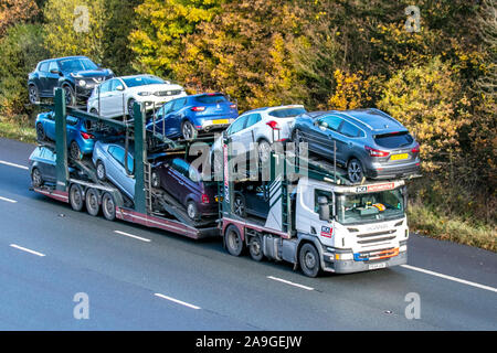 BCA Automotive Haulage delivery trucks,  collection and deliveries, lorry, transportation, truck, cargo movers, SCANIA P410 vehicle, delivery, commercial transport, industry, on the M61 at Chorley, UK Stock Photo