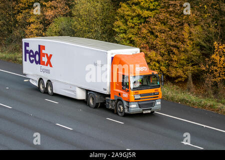 FedEx Express Haulage delivery trucks, lorry, transportation, truck, cargo, DAF CF vehicle, delivery, commercial transport, industry, on the M61 at Chorley, UK Stock Photo