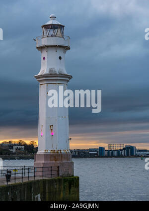 Newhaven Harbour, Edinburgh, Scotland, United Kingdom, 15th November 2019. UK Weather: a cold sunset with the temperature just a few degrees above freezing at Newhaven Lighthouse on the shore of the Firth of Forth