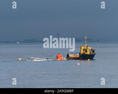 Sinking of a sunk foundered Beneteau First 40 off Cowes Gurnard bay Solent salvage rudder loss break Stock Photo