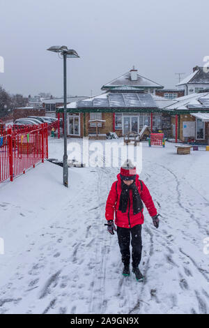 Cheam ,Surrey, UK, Primary school boy leaving school in the snow Stock Photo