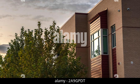 Panorama frame Corner of modern two storey building near sunset Stock Photo