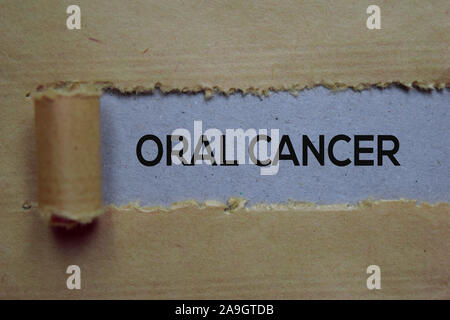 Oral Cancer Text written in torn paper. Medical concept Stock Photo