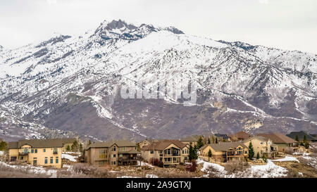 Panorama Hill top with family homes and abundant trees against overcast sky  in winter Stock Photo - Alamy