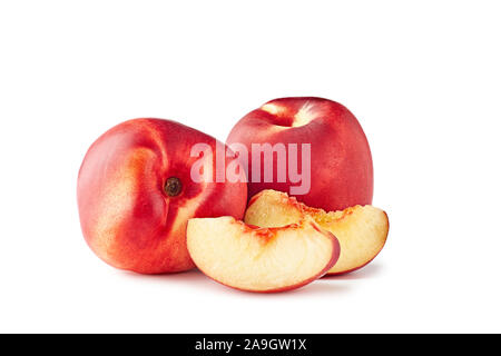 Two ripe nectarines with slices on white background Stock Photo