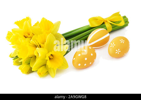 Daffodils and yellow Easter eggs Stock Photo