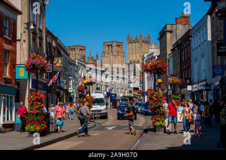 The towers of Wells Cathedral from High Street Wells Stock Photo