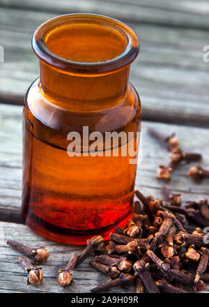 Essential oil with cloves Stock Photo