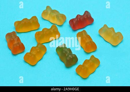 Colorful jelly candy pile on blue background Stock Photo