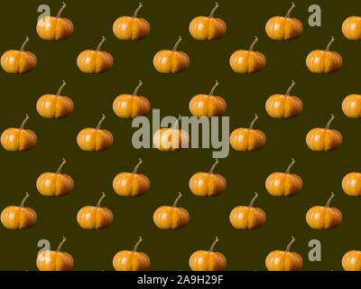 Seamless pattern of photos of pumpkins on a dark brown background. Stock Photo