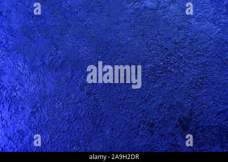 Background texture of a textured wall in blue. Stylized textural banner with space for text. Stock Photo