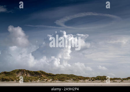 Imposing cloud formations over the dunes on the island of Terschelling Stock Photo