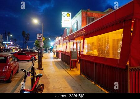Restaurants are visible at night along Washington Blvd, a main road in Venice, Los Angeles, California, October 27, 2019. () Stock Photo