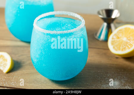 Homemade Frozen Blue Jack Frost Cocktail with Lemon and Vodka Stock Photo