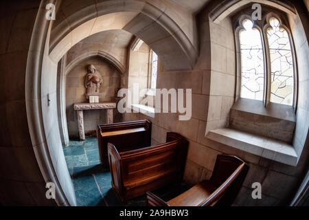 WASHINGTON, DC - The tiny Chapel of the Good Shepherd in the lower level of the National Cathedral in Washington DC. Washington National Cathedral is an Episcopal church located in Washington DC and is the site of many of Washington DC's prominent church and remembrance services. Designed in the Neo-Gothic style, its construction was begun in 1906, with work continuing over following decades. It is the second-largest church building in the United States and stands as the fourth-tallest structure in Washington DC, a feature emphasized by sitting on a high point overlooking over the city. It is  Stock Photo