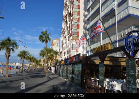 Cafe restaurant on the promenade of Playa Levante beach, with Union Jack flags on the exterior of the building, Benidorm, Alicante Province, Spain Stock Photo