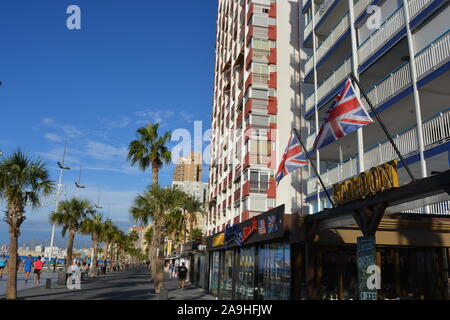 Cafe restaurant on the promenade of Playa Levante beach, with Union Jack flags on the exterior of the building, Benidorm, Alicante Province, Spain Stock Photo