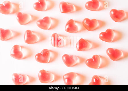 Pink heart shaped gummies pattern. Stock Photo