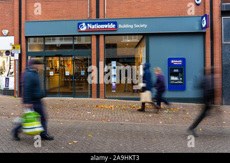 People, shoppers walk past the Nationwide building society and bank on the high street and city centre, Hanley, Stoke on Trent, Staffordshire Stock Photo