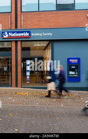 People, shoppers walk past the Nationwide building society and bank on the high street and city centre, Hanley, Stoke on Trent, Staffordshire Stock Photo