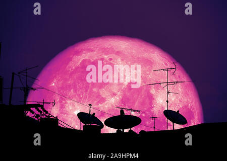 full Strawberry moon planet back silhouette Satellite dishes on roof, Elements of this image furnished by NASA Stock Photo