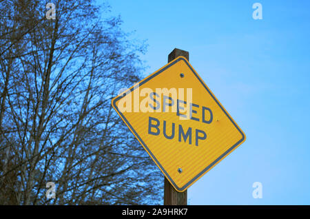 Speed bump sign in the woods Stock Photo