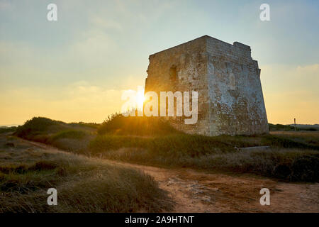Ruins of Torre Pozzelle An Antique Coastal Watchtower In a Colourful Sunset Ostuni Puglia Italy. Stock Photo