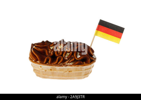 Cocholoate covered ice cream boat with the flag of Germany isolated on white background. Stock Photo