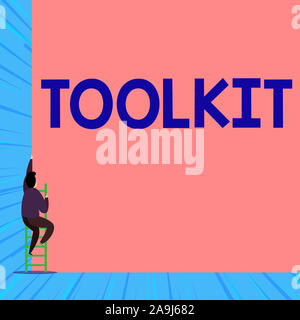 Text sign showing Toolkit. Business photo showcasing set of tools kept in a bag or box and used for a particular purpose Back view young man climbing Stock Photo