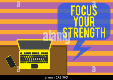 Writing note showing Focus Your Strength. Business concept for Improve skills work on weakness points think more Office working place laptop lying woo Stock Photo