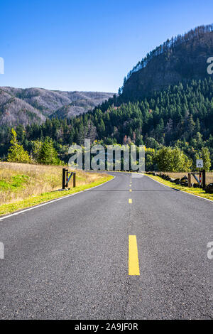 The Stunning scenic road in the protected national park area of the Columbia River Gorge along the riverbank of the Columbia River with ridge of rocky Stock Photo