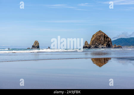 Rocks sticking out of the water in the coastal strip of the Northeast Pacific Ocean are a great place for relaxing and walking through the fresh sea a Stock Photo