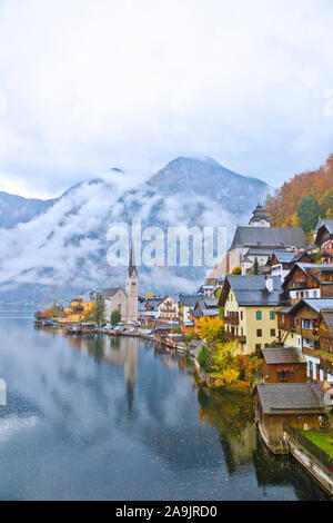 Hallstatt town view in a foggy day and clouds between the mountains, Austria. Stock Photo
