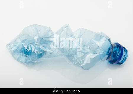 Blue crashed plastic bottle isolated on white background Stock Photo