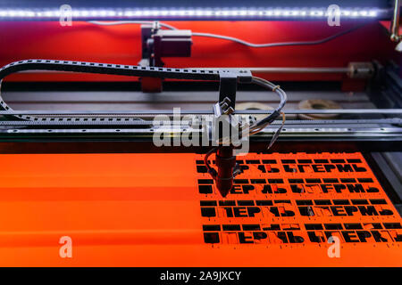 Perm, Russia - November 14, 2019: manufacturing plywood souvenirs on an automatic laser cutting machine Stock Photo