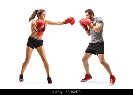 Full length shot of a young man and woman boxing isolated on white background Stock Photo