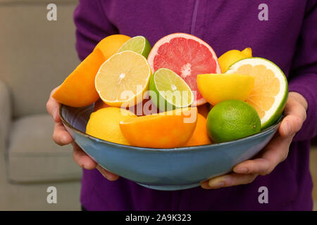 Woman Hands Holding Assorted Citrus Fruit Stock Photo