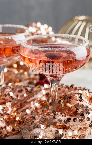 Pink champagne in festive environment. Concept of holiday drink. Drinks for new year and birthday party Stock Photo