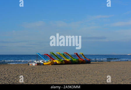 Pedal boats with slides, on the dry sand of Playa Levante beach, Benidorm, Alicante Province, Spain Stock Photo