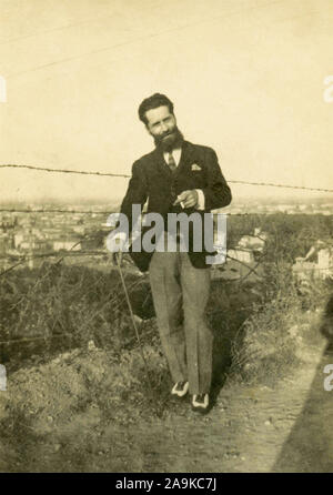 Man with long beard and stick, Italy Stock Photo