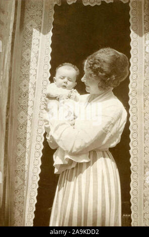 Woman with child in her arms, Denmark Stock Photo