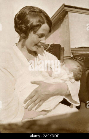 Woman with child in her arms, Denmark Stock Photo