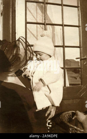 Woman with child in her arms, Denmark Stock Photo