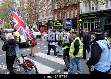 Charing Cross Road, London, UK. 16th Nov, 2019. A small group of about 20 'Yellow vests' pro Brexit protesters marching along Charing Cross Road. Credit: Matthew Chattle/Alamy Live News Stock Photo