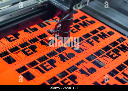 Perm, Russia - November 14, 2019: manufacturing plywood souvenirs on an automatic laser cutting machine Stock Photo
